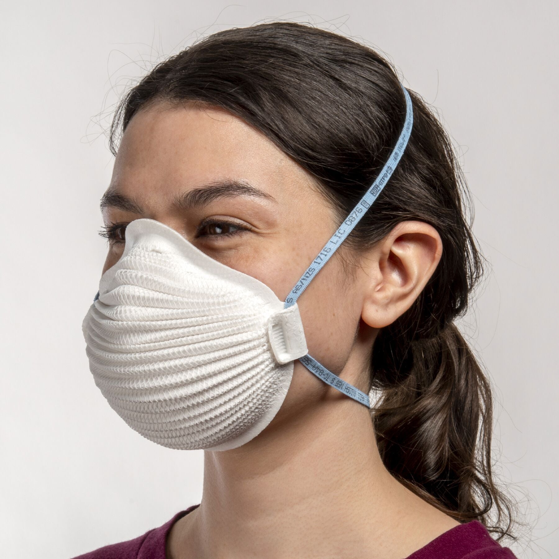 woman wearing small white Airwave 4601 NIOSH N95 respirator mask from Canada Strong Masks.